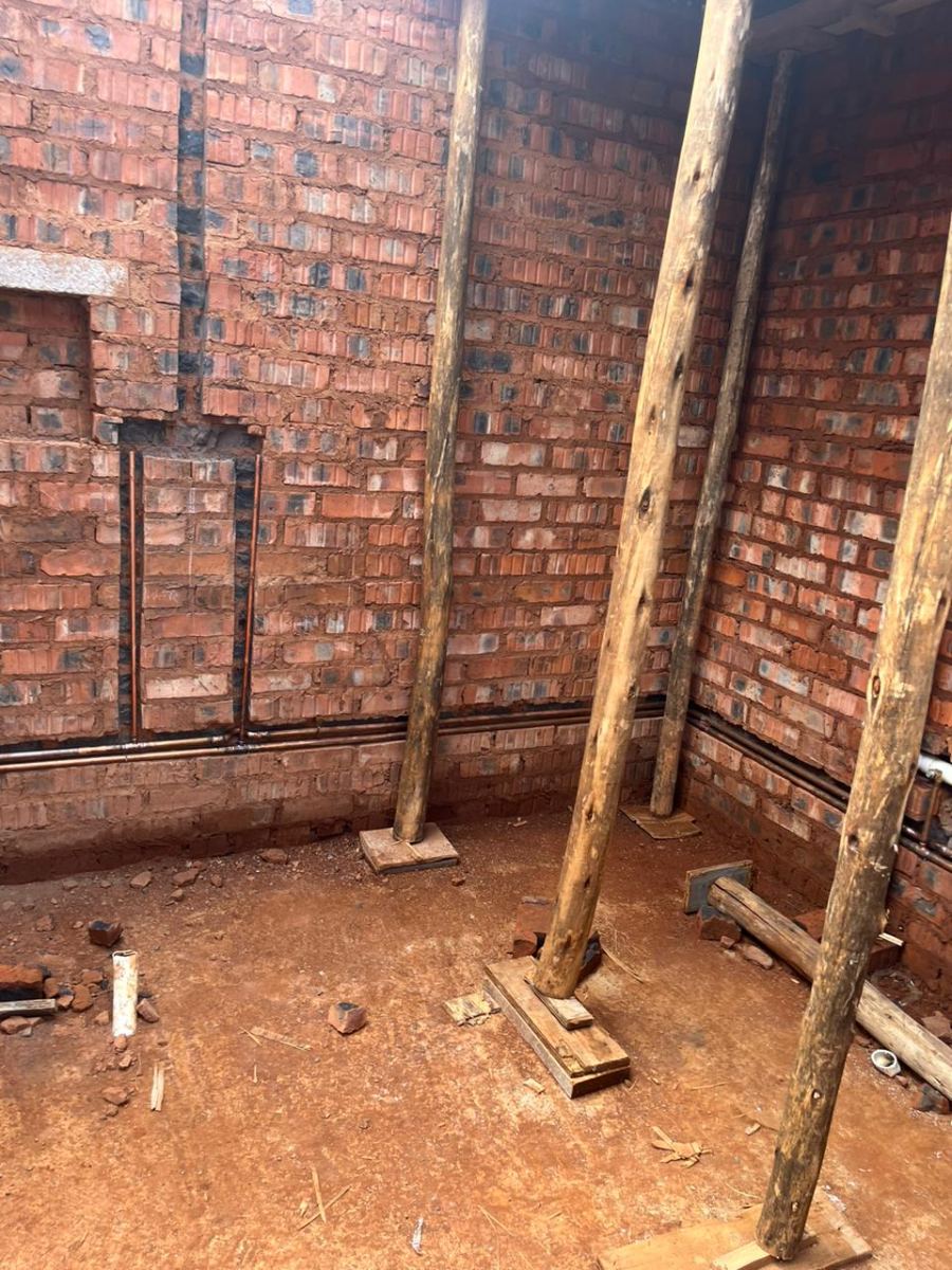 Copper supply pipework chased into brick walls during construction plumbing